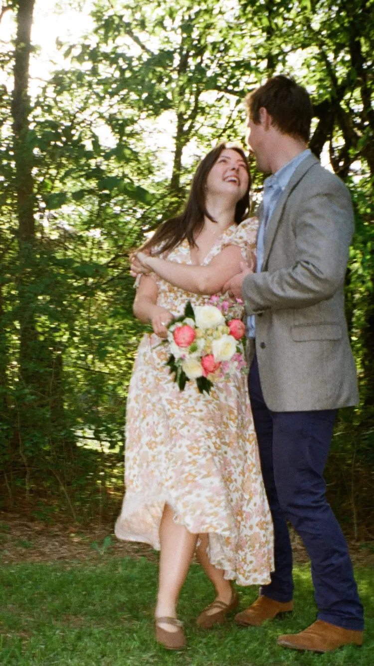 A bride holding a Wedding Box Florals bouquet